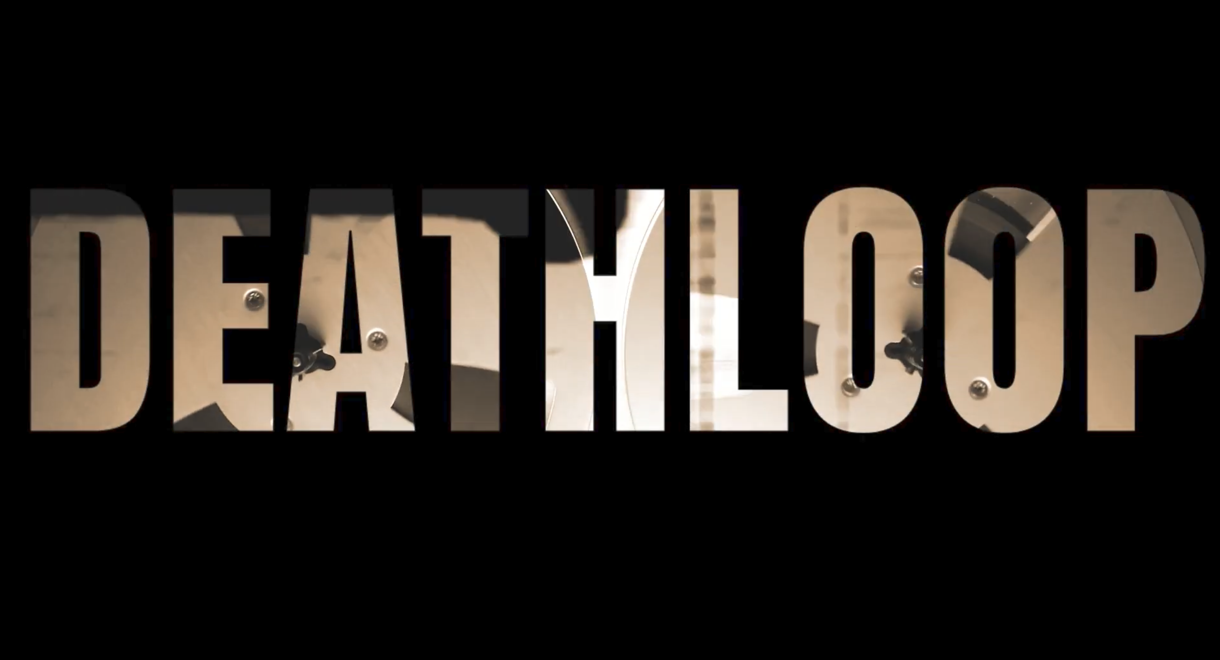 Deathloop title over reel-to-reel tape imagery